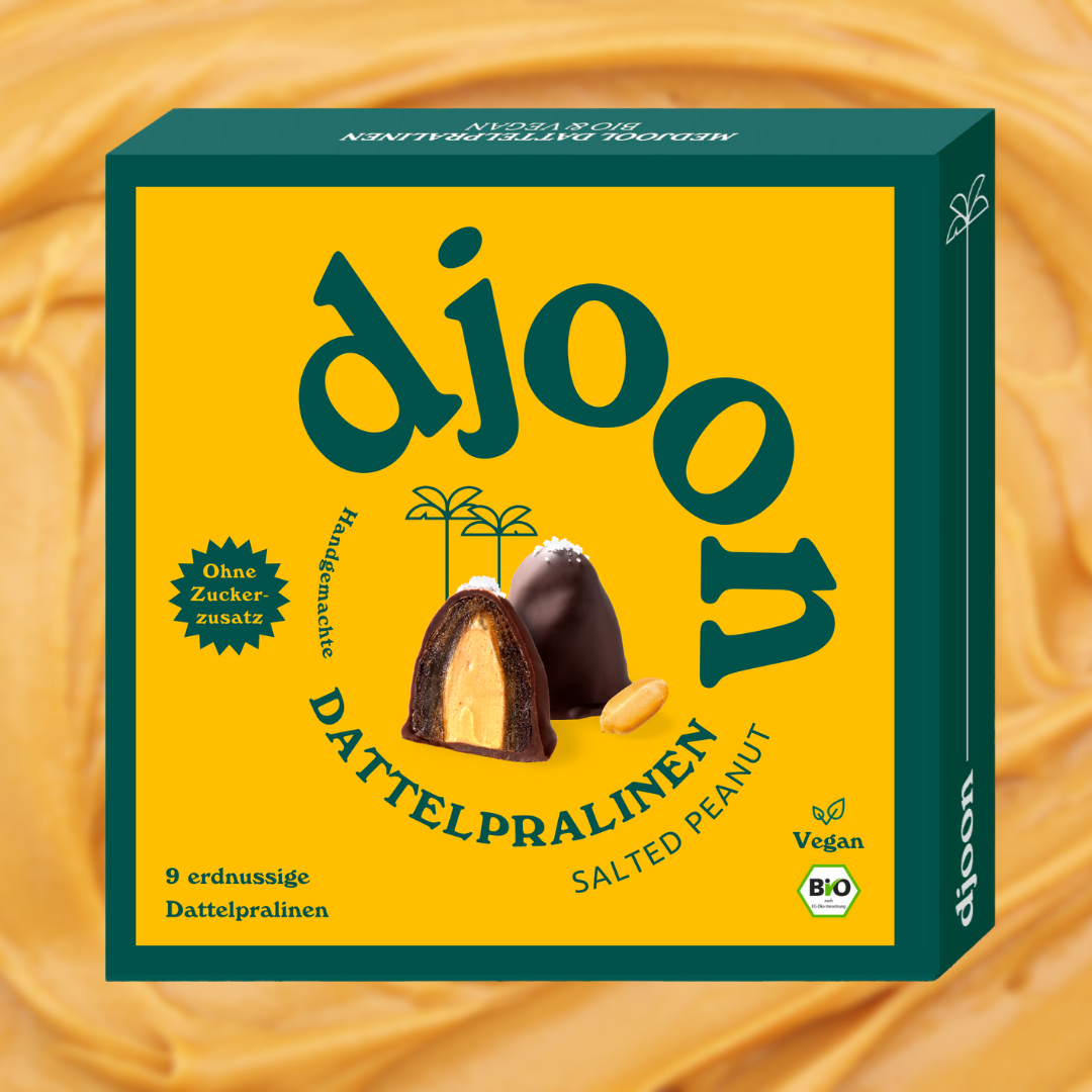 Eine kleine Schachtel Pralinen der Marke djoon foods GmbH. Bio, vegan und ohne Zuckerzusatz.